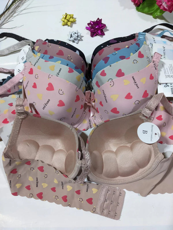 Set of bras with colorful patterns on a white background