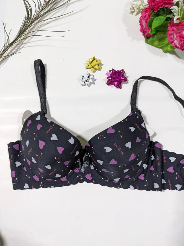 Navy blue bra with heart pattern on a white background