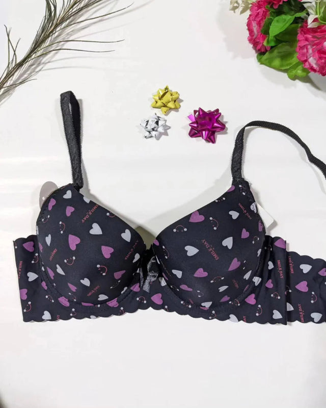 Black bra with heart pattern on a white background